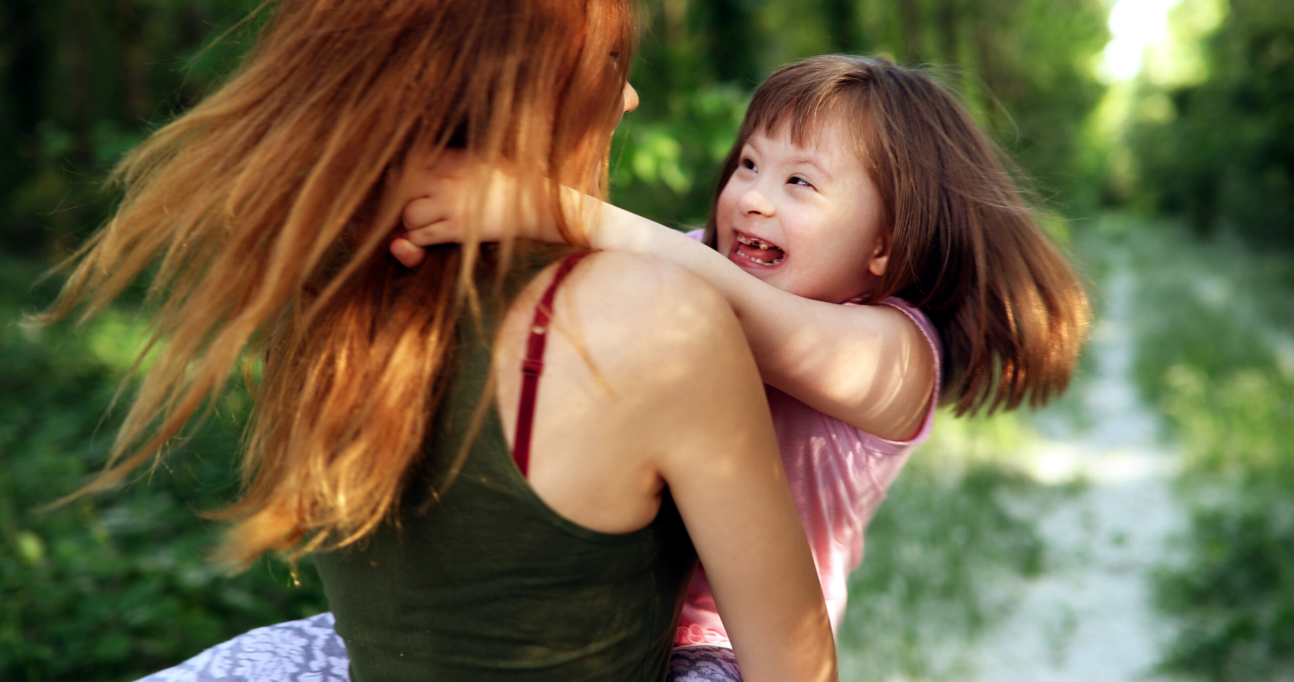 Little girl with special needs enjoy spending time with mother